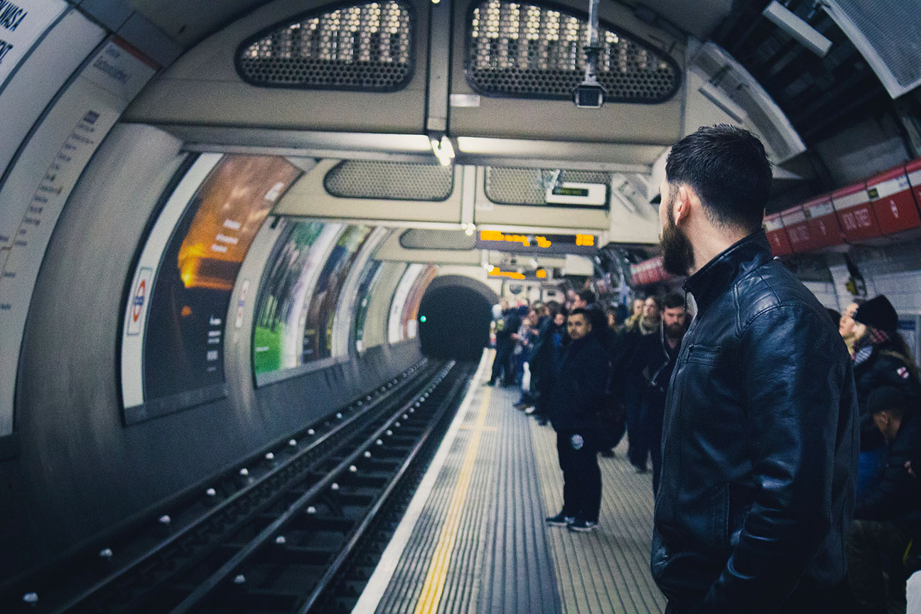 People wait for a subway train.