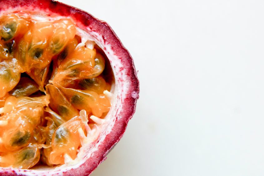 A passion fruit cut in half.
